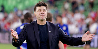 Pochettino lacht.jpg