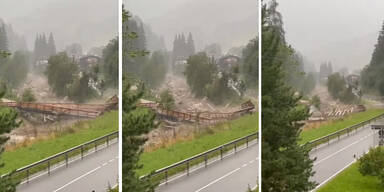 Wassermassen reißen Brücke mit